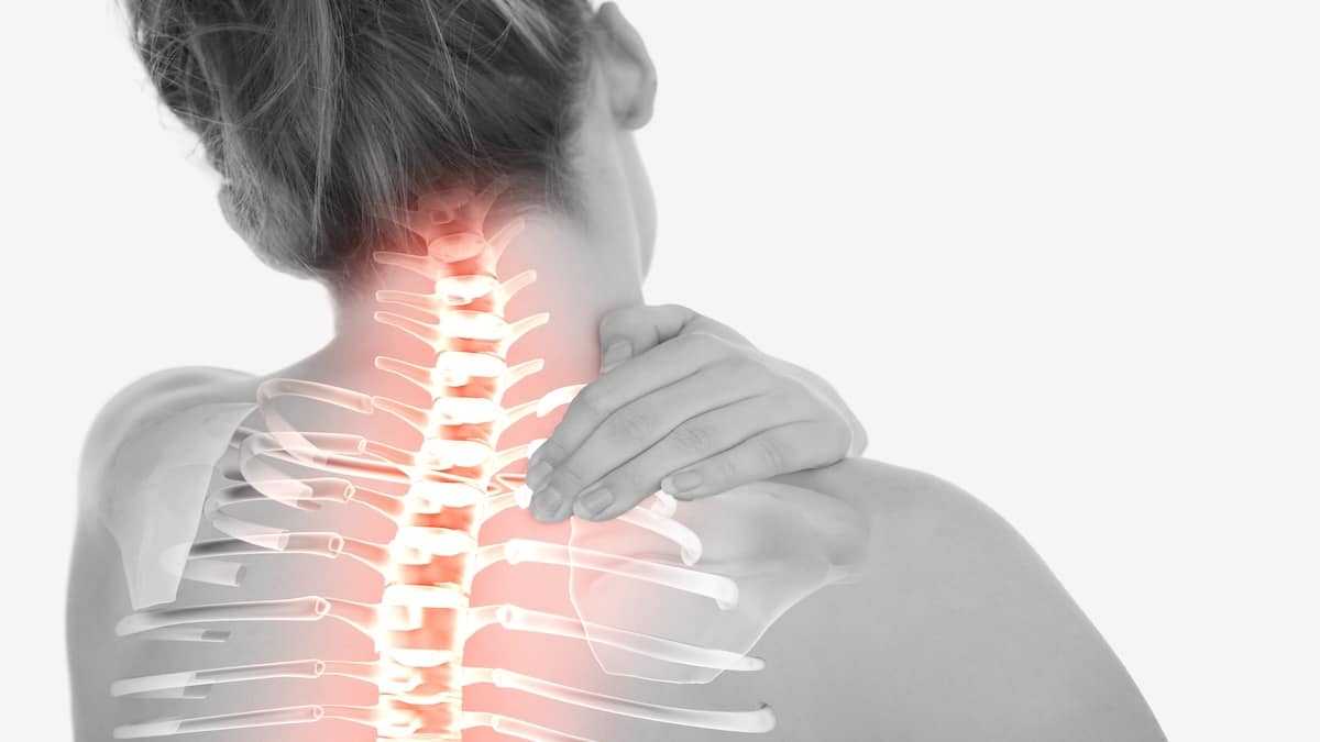 Woman holding her neck with the cervical spine glowing red to show pain, neck pain acupuncture in Delray Beach